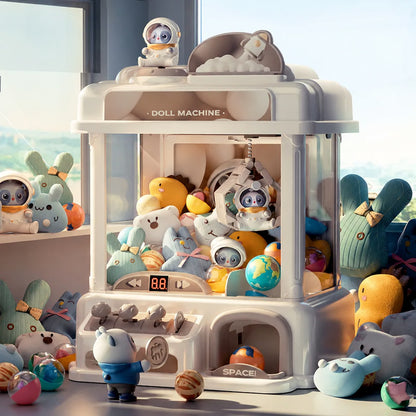 Mini claw machine by a window with plush toys