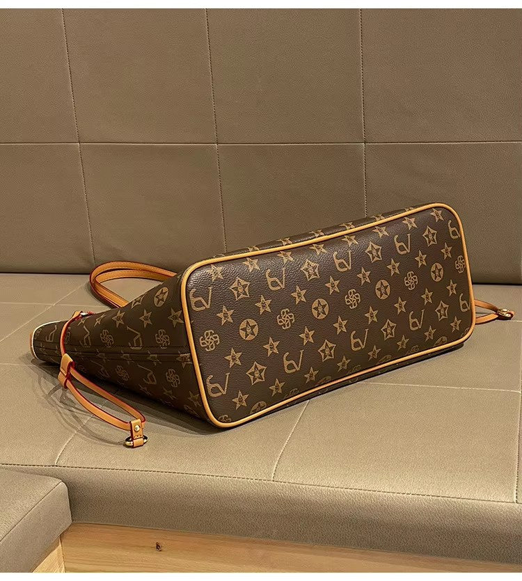 Bottom view of brown patterned tote with tan piping