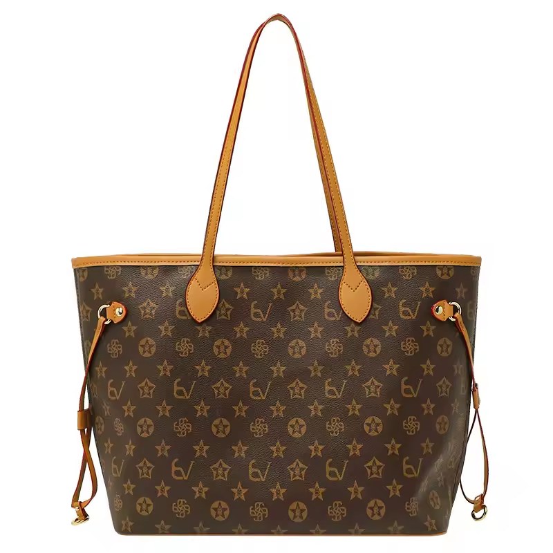 Front view of brown patterned tote with tan handles and side cords