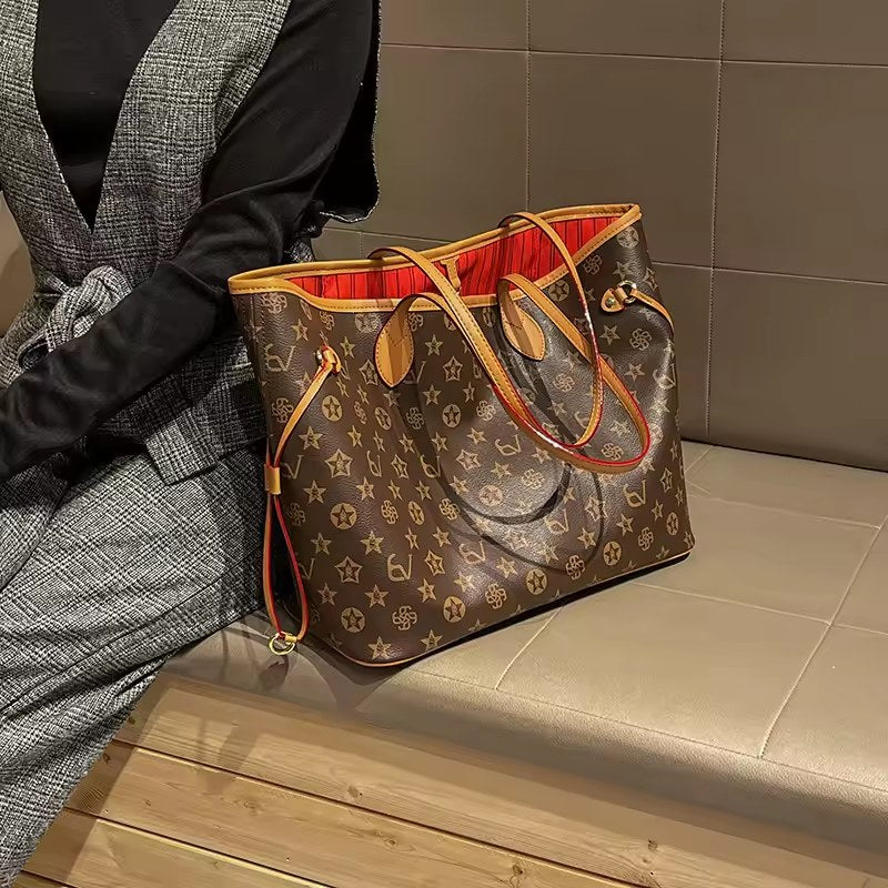 Brown patterned tote with tan handles beside a seated woman
