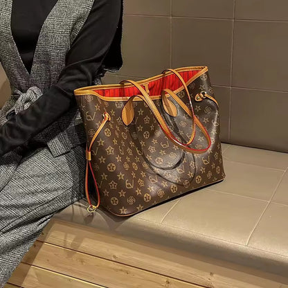Brown patterned tote with tan handles beside a seated woman