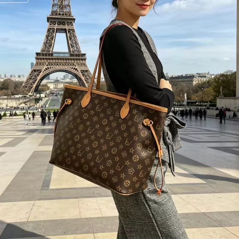 Woman carrying the brown patterned tote over her shoulder